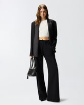 Pantaloni in denim con banda laterale in pizzo - | Pinko