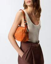 Medium crossbody bowler bag in crocodile-print leather - | Pinko