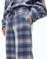 Pantaloni palazzo con motivo check e paillettes - | Pinko