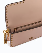 Baby Love Bag One Slouchy crossbody bag in leather with studs - Pink | Pinko