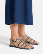 Sandalias planas de piel con estampado de pitón y tachuelas - | Pinko