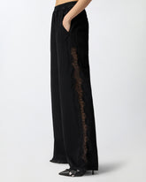 Pantaloni in denim con banda laterale in pizzo -  | Pinko