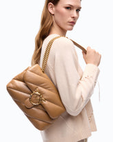 Bolso bandolera mediano Love Bag Puff de napa acolchada con hebilla tipo joya -  | Pinko