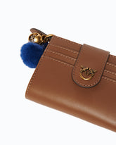 Portefeuille multifonction en cuir avec pompon -  | Pinko