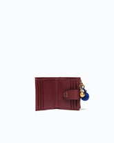 Portefeuille multifonction en cuir avec pompon -  | Pinko