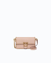Baby Love Bag One Slouchy crossbody bag in leather with studs - Pink | Pinko