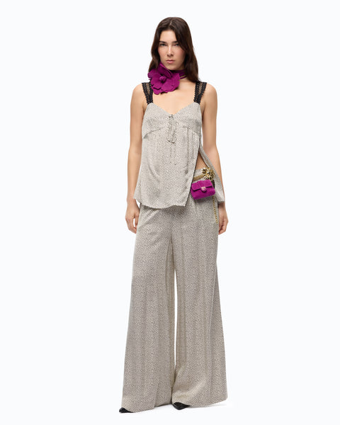Pantaloni svasati in satin a pois