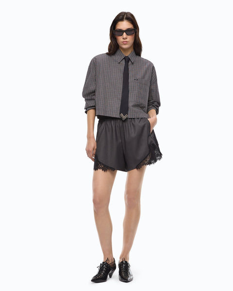 Shorts fluidi con inserto in pizzo