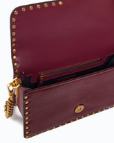 Small Love One Slouchy crossbody bag in leather with studs - Bordeaux | Pinko
