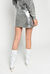 Laminated mini skirt with studs