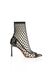 Décolleté in vernice con calza a rete