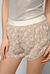 Shorts in fil coupé disegno maculato
