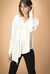 Blusa in crêpe de chine di seta asimmetrica